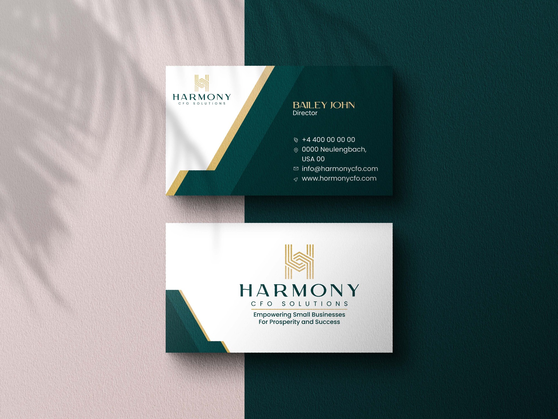 Business card system in deep teal and gold.